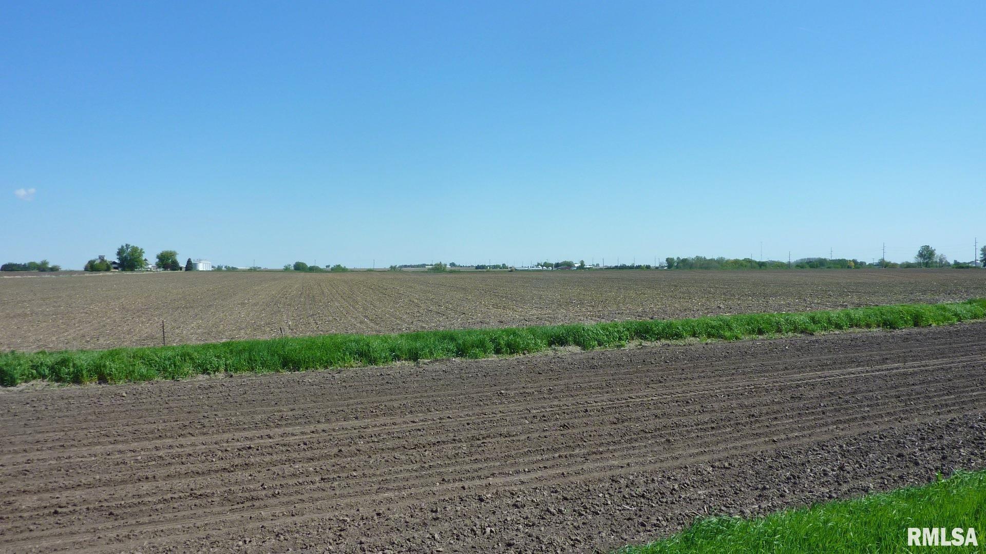 7936 Utica Ridge Road Davenport, IA 52807 - Photo 20 of 22 a view of an ocean beach and a yard