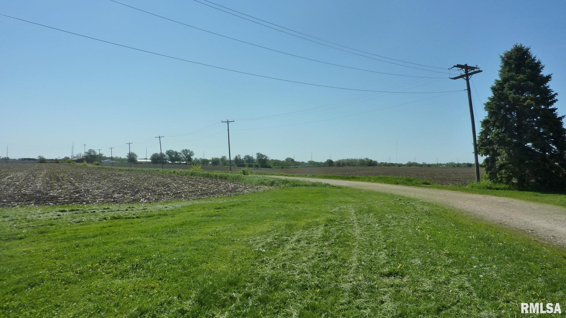 7936 Utica Ridge Road Davenport, IA 52807 - Photo 8 of 22 a view of a green field with trees in the background