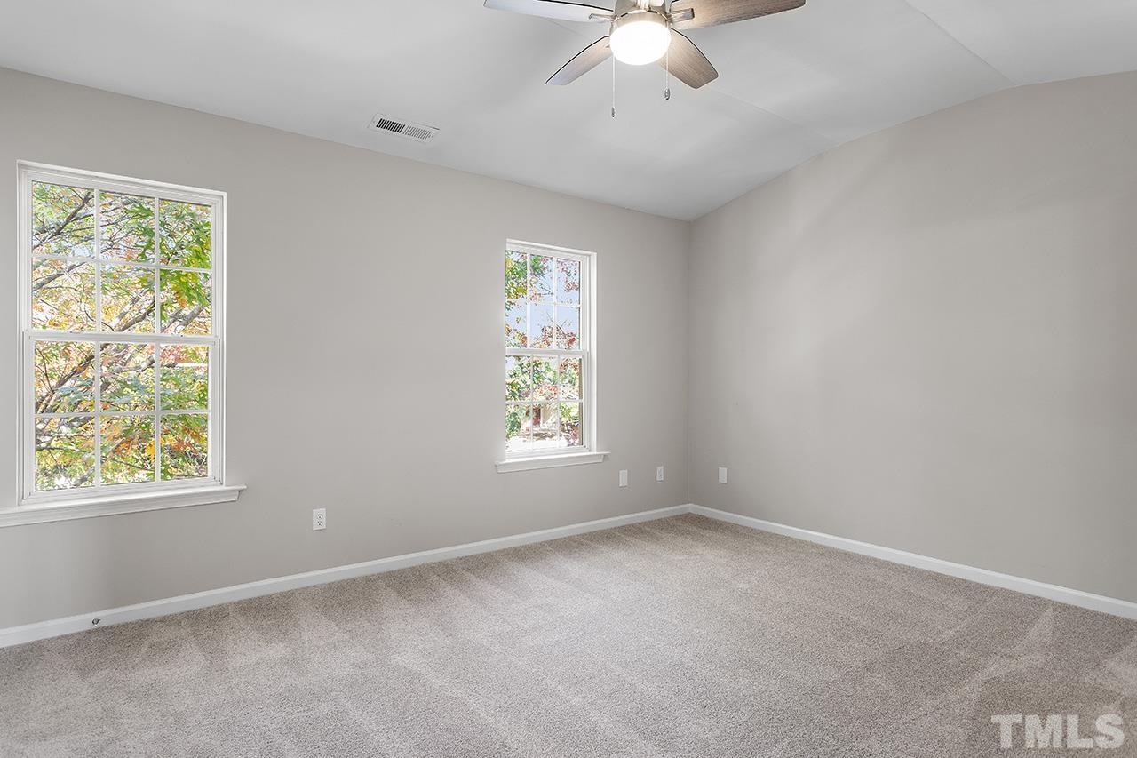 8516 Micollet Court Raleigh, NC 27613 - Photo 15 of 26 a view of an empty room with a window