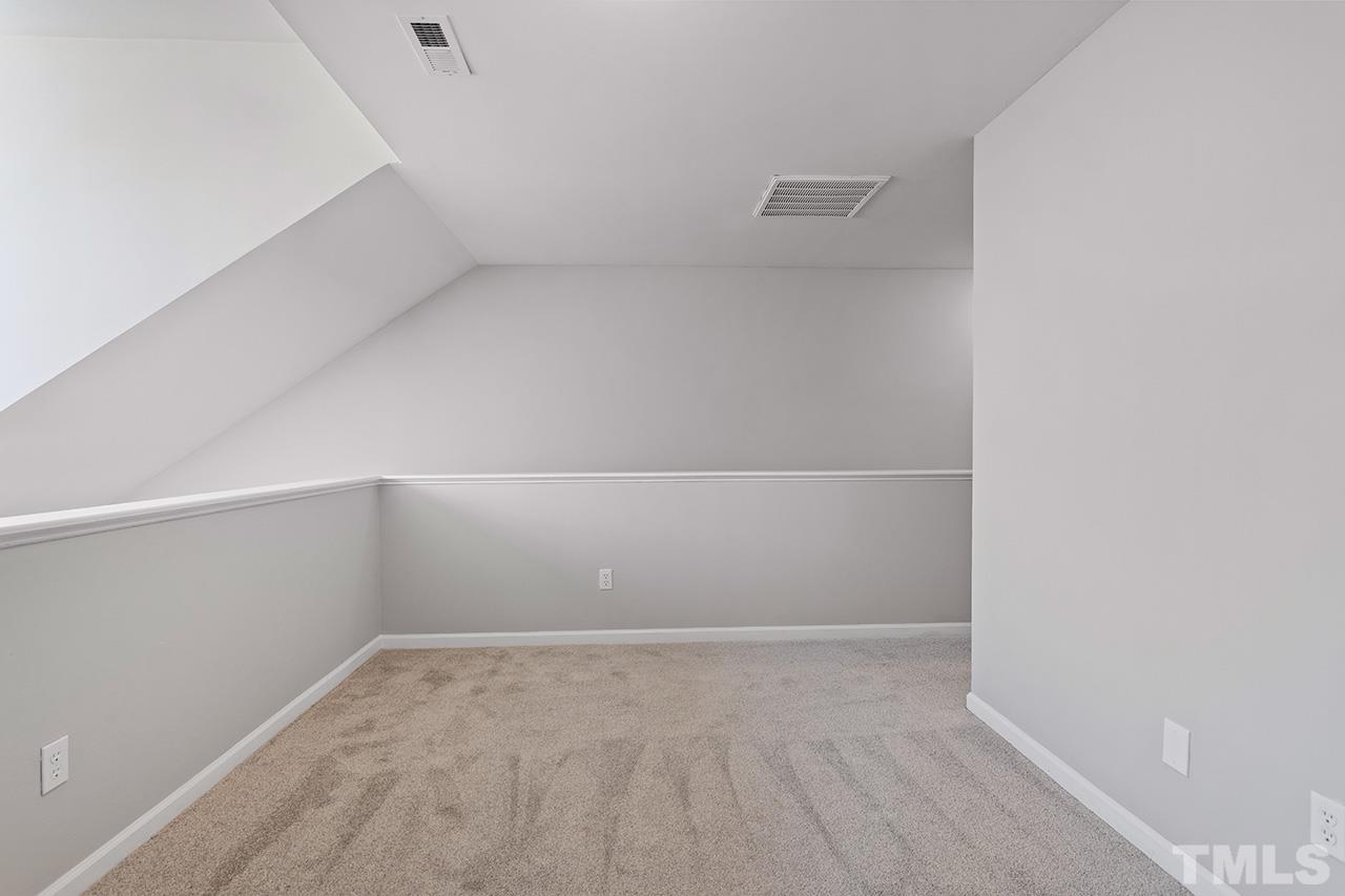 8516 Micollet Court Raleigh, NC 27613 - Photo 23 of 26 a view of an empty room