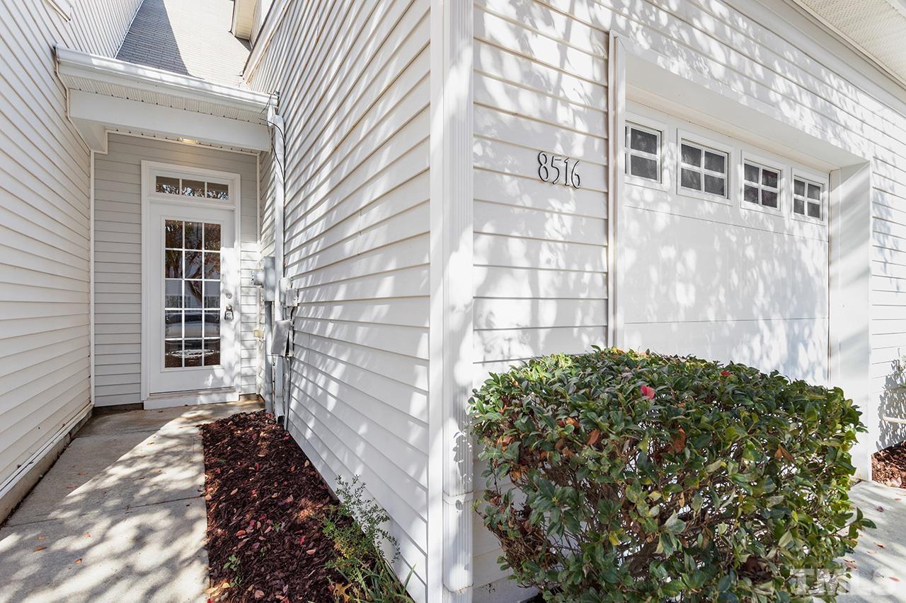 8516 Micollet Court Raleigh, NC 27613 - Photo 26 of 26 a view of a pathway along a building
