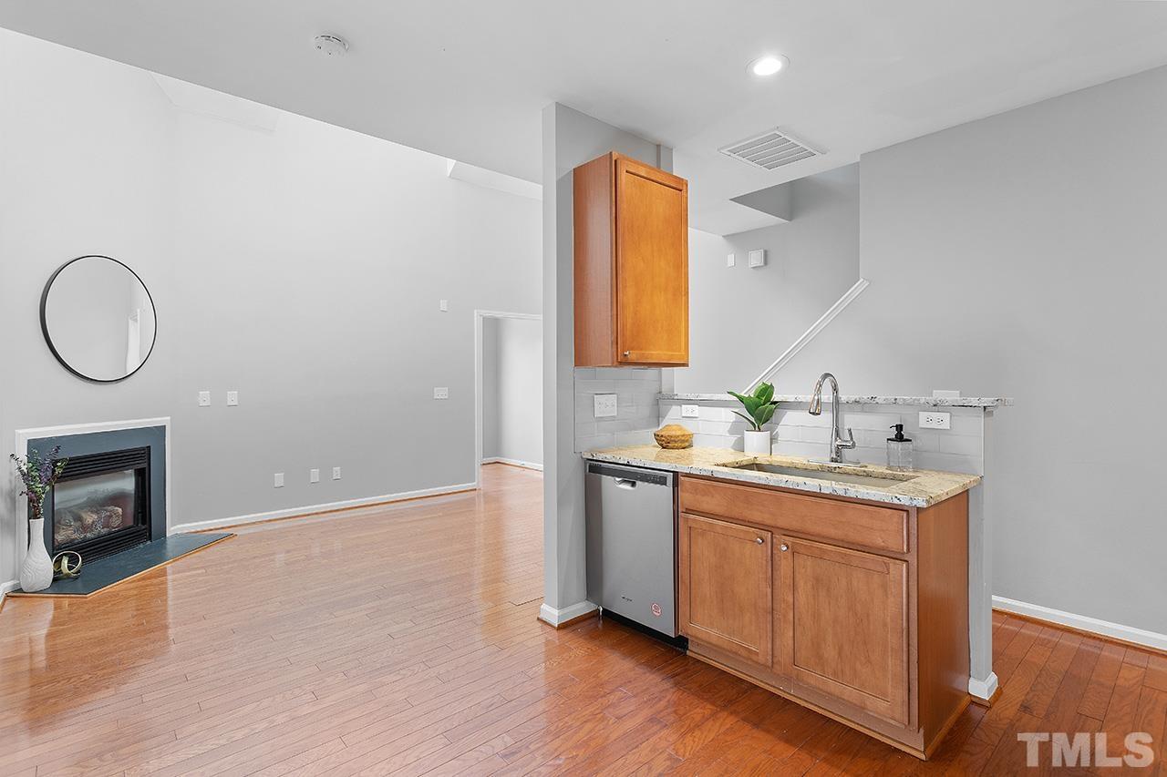 8516 Micollet Court Raleigh, NC 27613 - Photo 3 of 26 a spacious bathroom with a granite countertop sink a mirror and a