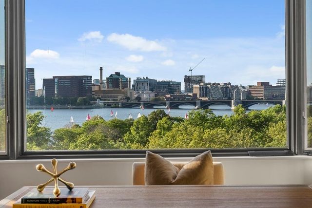 a view of a lake with a city from a chair