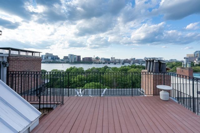 a view of balcony with wooden floor