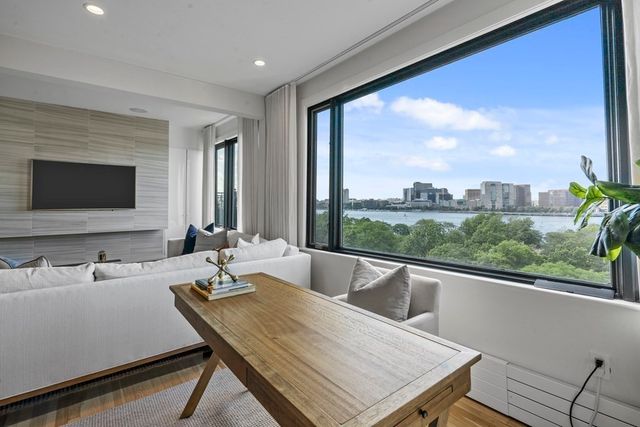 a room with a large window and a table