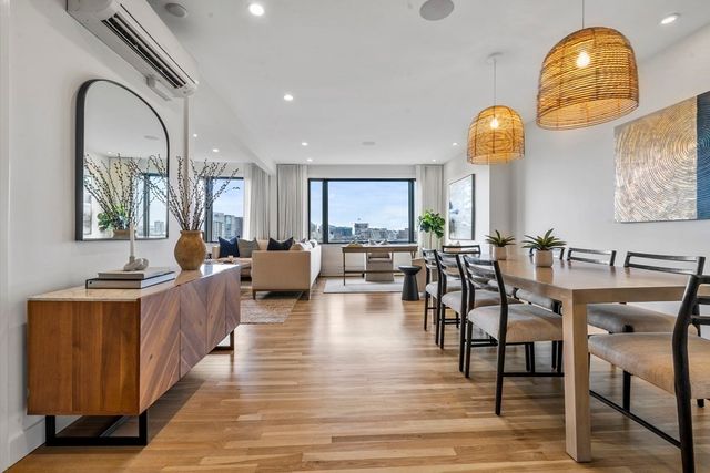 a living room with fireplace furniture and a wooden floor