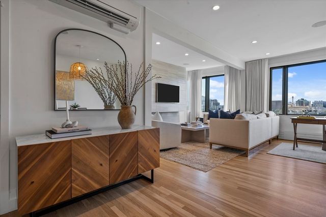 a living room with a couch and a flat screen tv