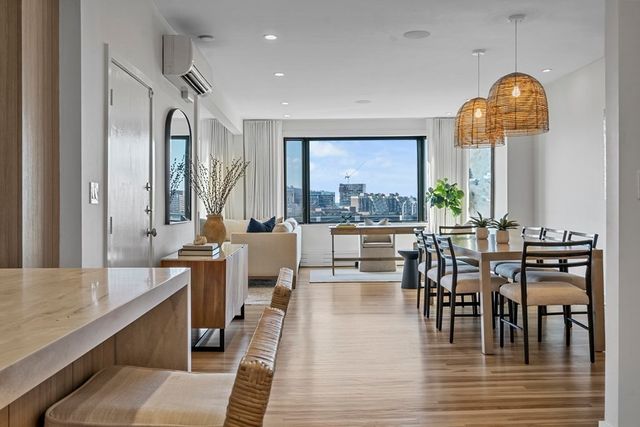 a view of a dining room with furniture window and outside view