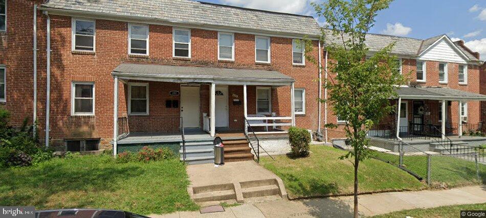 224 North Culver Street Baltimore, MD 21229 - Photo 5 of 5 a front view of a house with garden