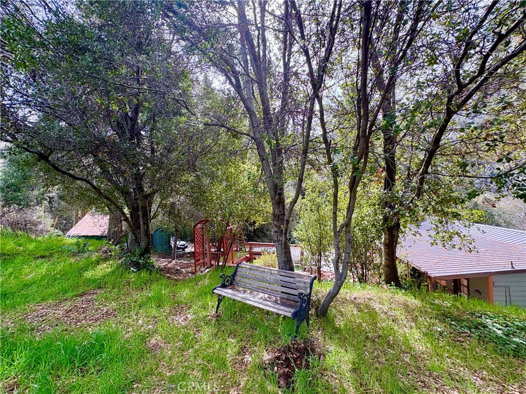 36750 Hilltop Road Yucaipa, CA 92399 - Photo 25 of 27 a garden view with a seating space