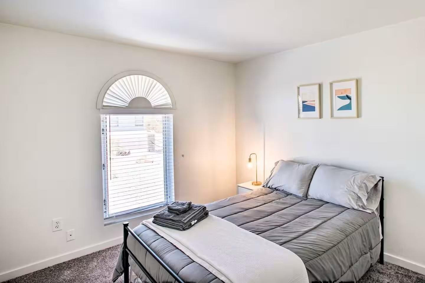 1233 East Marny Road Tempe, AZ 85288 - Photo 17 of 20 a bedroom with a bed and a window
