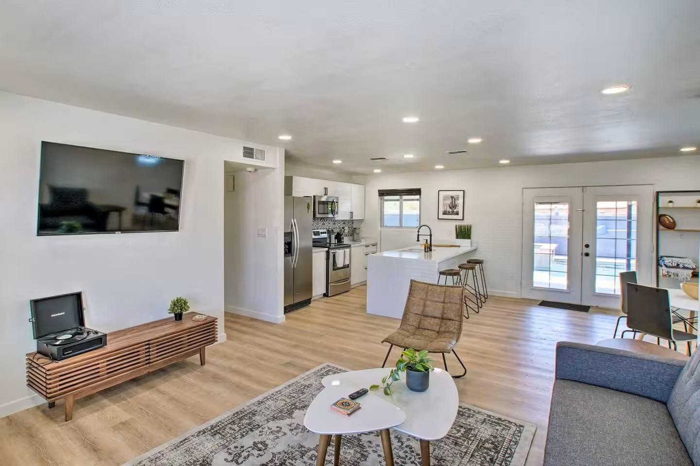 1233 East Marny Road Tempe, AZ 85288 - Photo 2 of 20 a living room with furniture and a flat screen tv