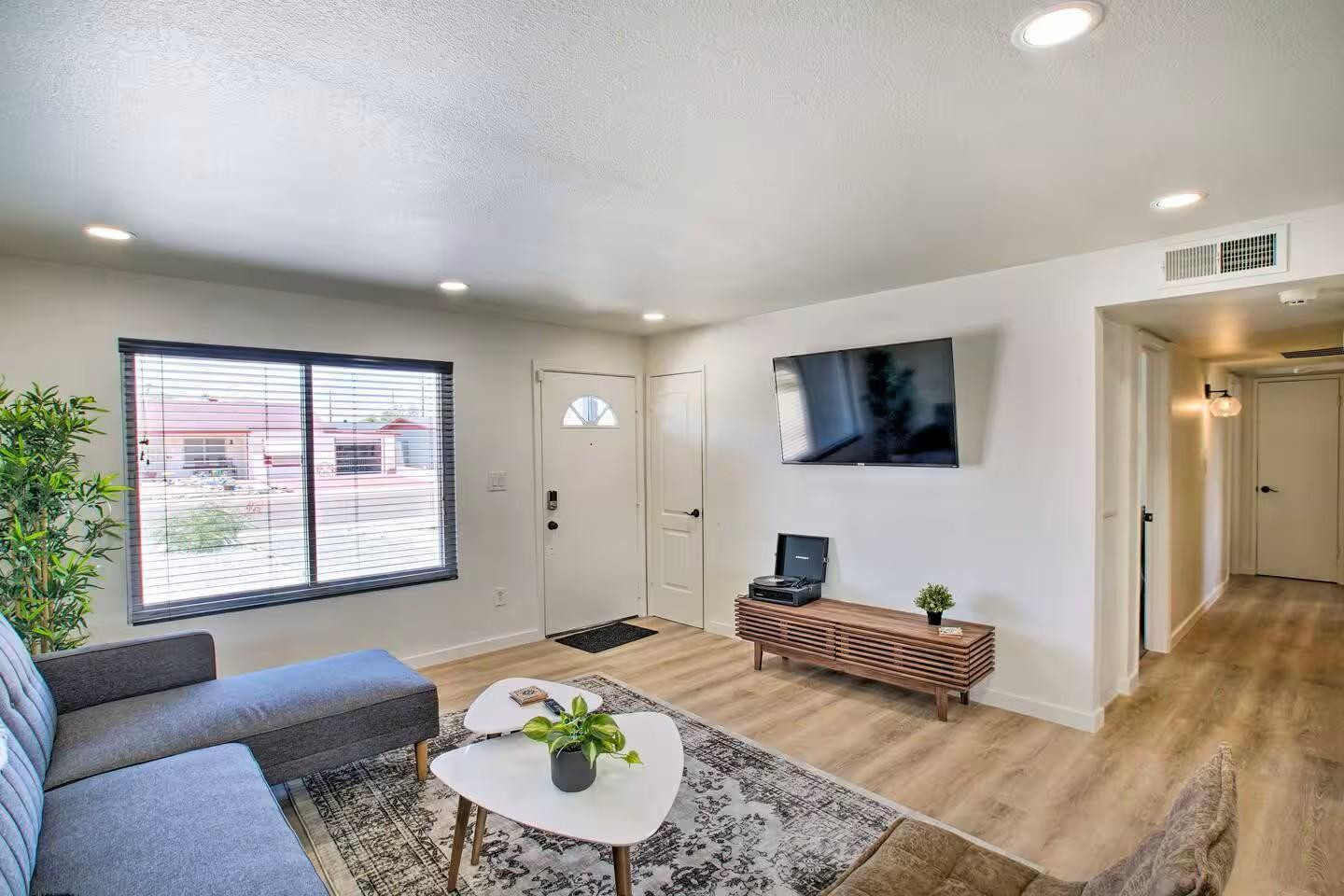 1233 East Marny Road Tempe, AZ 85288 - Photo 4 of 20 a living room with furniture and a flat screen tv