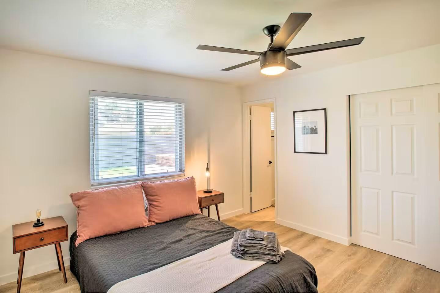 1233 East Marny Road Tempe, AZ 85288 - Photo 8 of 20 a bedroom with a bed and a chandelier