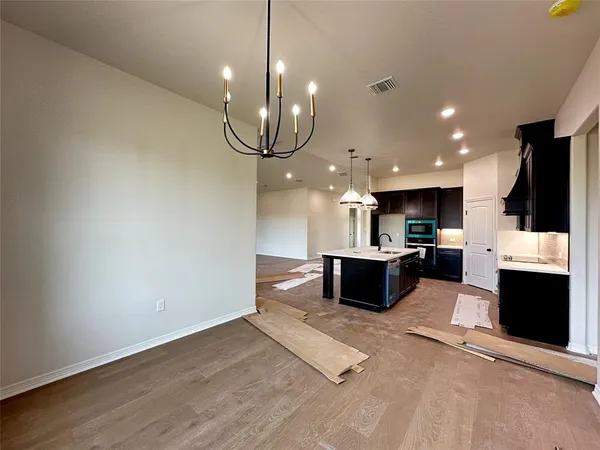 a kitchen with a refrigerator and a microwave