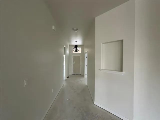 a kitchen with stainless steel appliances a stove refrigerator and microwave