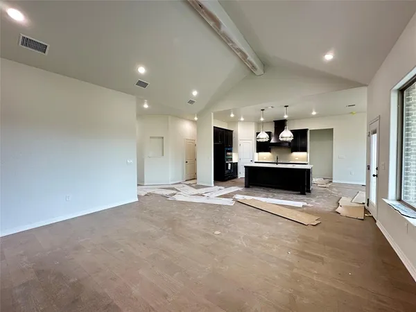 a view of kitchen and kitchen with stainless steel appliances