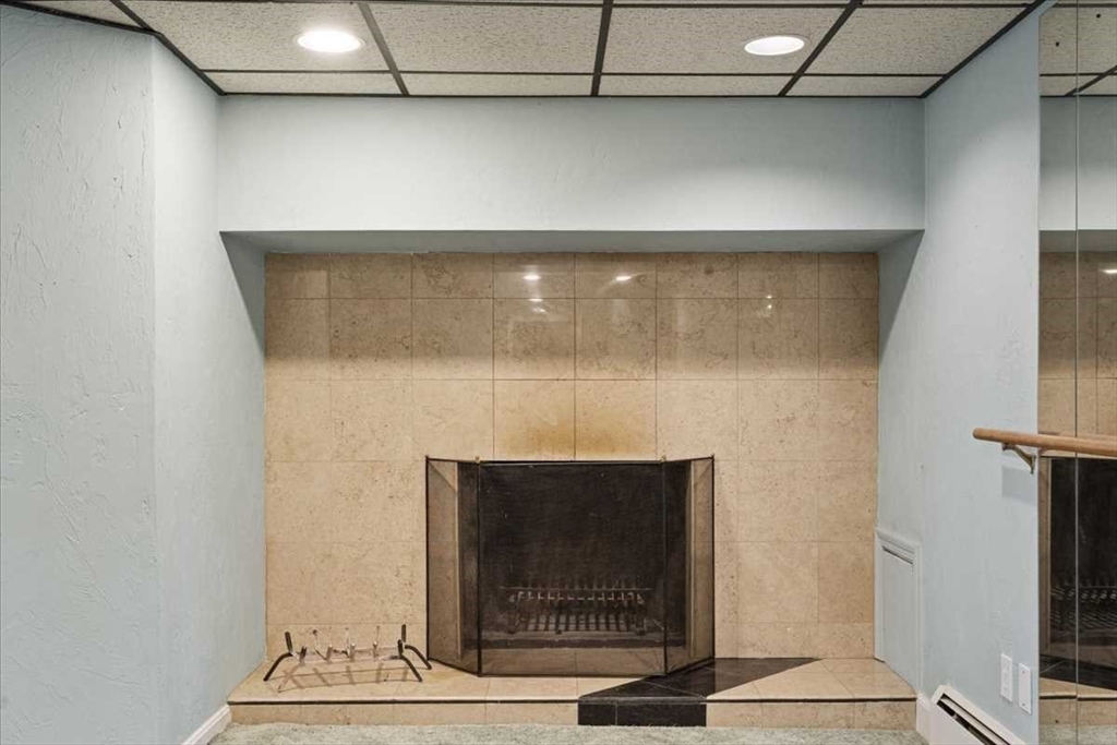 77 Zenith Drive Worcester, MA 01602 - Photo 35 of 40 a room with a fireplace
