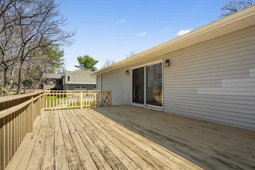 77 Zenith Drive Worcester, MA 01602 - Photo 7 of 40 a view of balcony with wooden floor and fence