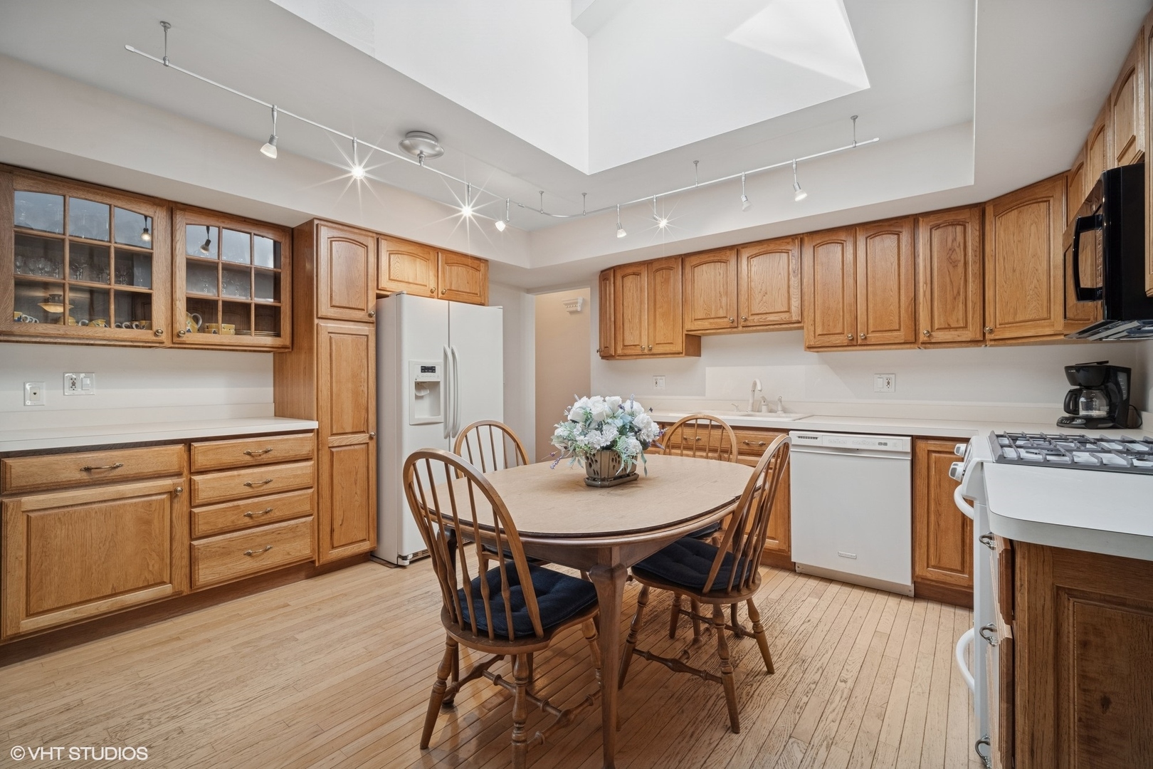 1713 Laurel Drive Mount Prospect, IL 60056 - Photo 6 of 15 a kitchen with a table chairs sink and cabinets