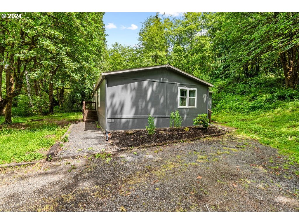 119 Ragland Road Longview, WA 98632 - Photo 23 of 30 a view of backyard of house with green space