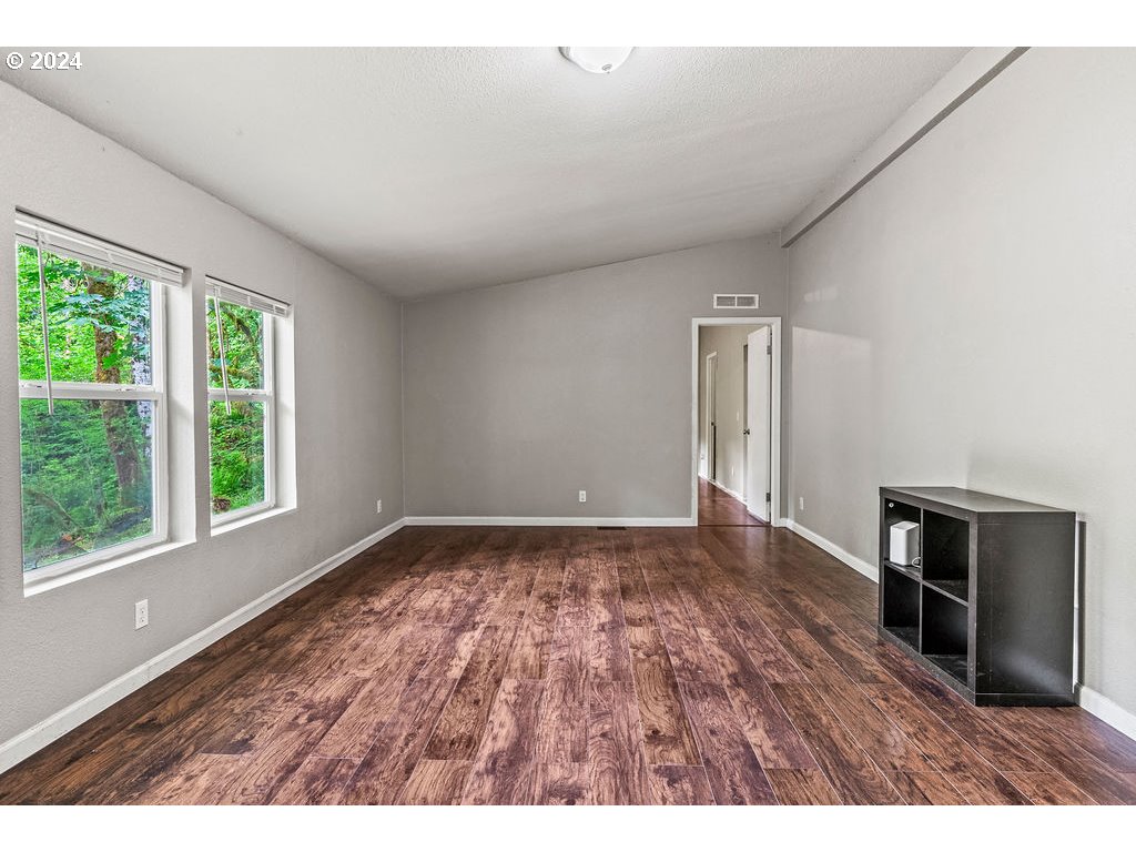 119 Ragland Road Longview, WA 98632 - Photo 4 of 30 a view of an empty room and window