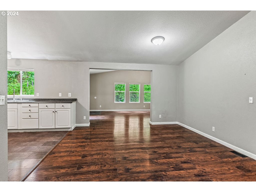 119 Ragland Road Longview, WA 98632 - Photo 5 of 30 a view interior of kitchen and hall with wooden floor
