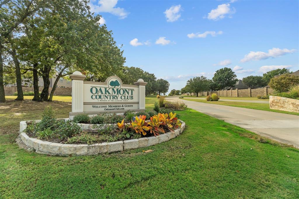7508 Cloverleaf Court Krum, TX 76249 - Photo 11 of 14 a sign board with a play ground in the back