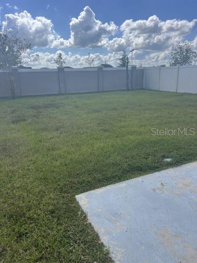 31284 Penny Surf Loop Wesley Chapel, FL 33545 - Photo 15 of 15 a view of a field with an trees in front of it