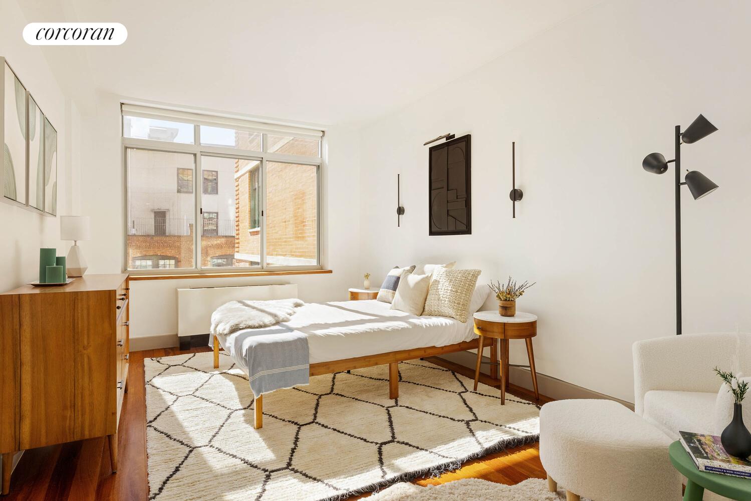 84 Front Street, Unit 7F Brooklyn, NY 11201 - Photo 6 of 12 a bathroom with a sink mirror vanity and toilet