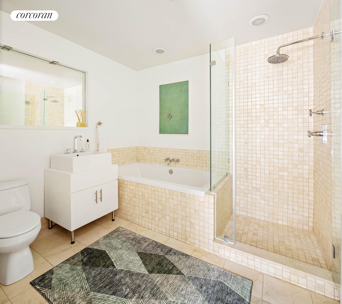 84 Front Street, Unit 7F Brooklyn, NY 11201 - Photo 7 of 12 a bathroom with a sink toilet and shower