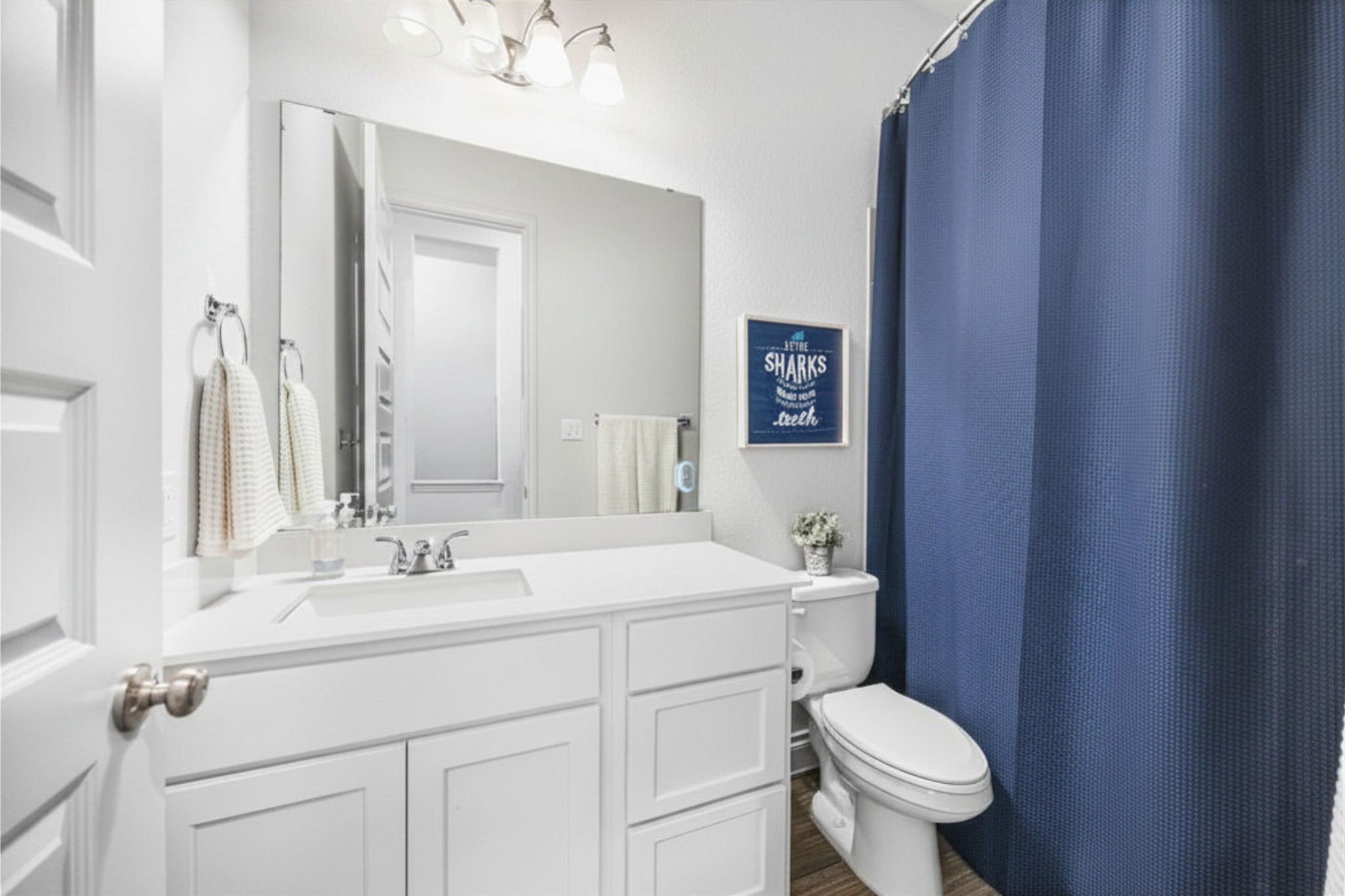 28169 Knight Peak Drive Spring, TX 77386 - Photo 23 of 33 a bathroom with a sink toilet and vanity