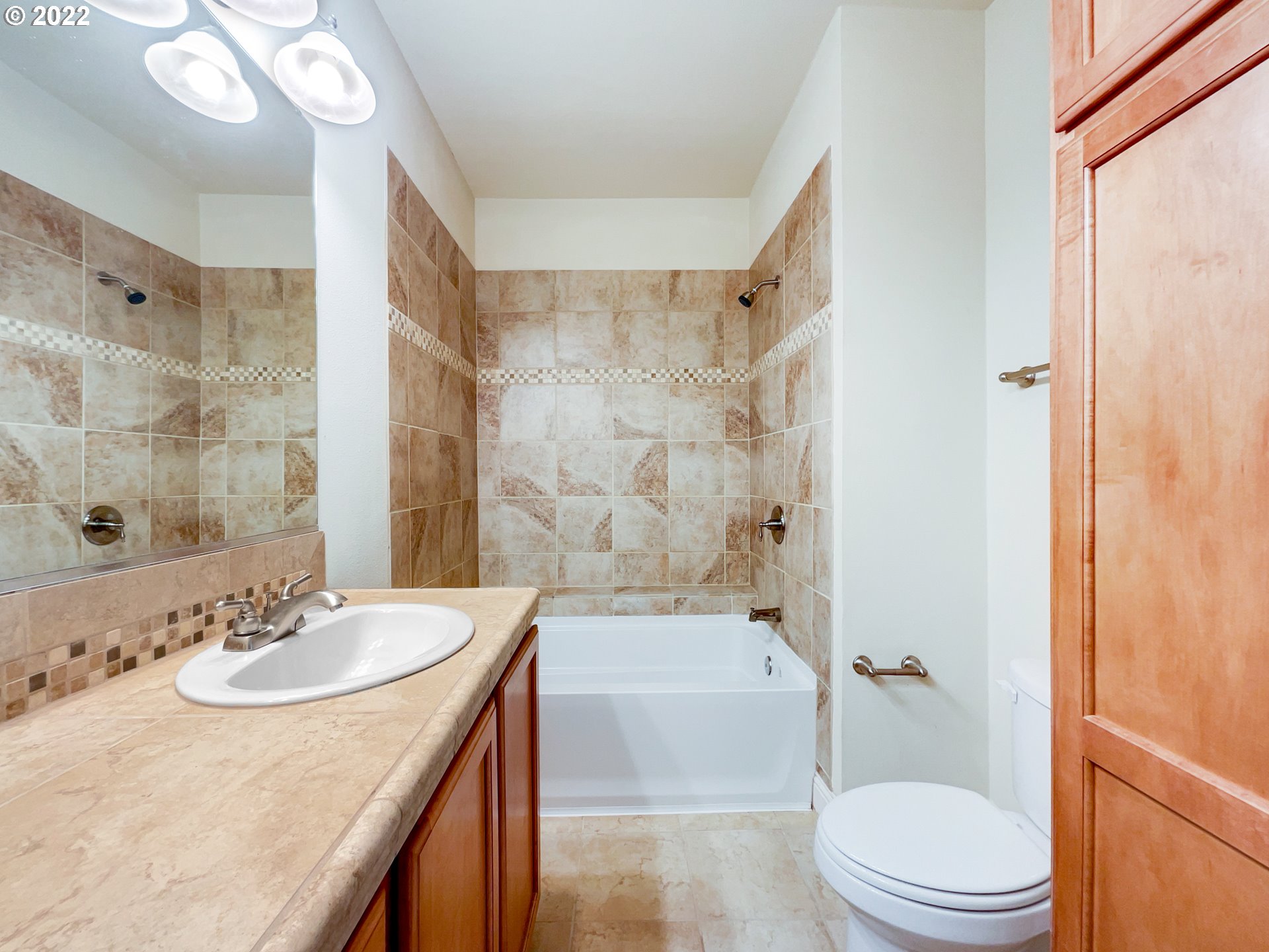 12111 Southeast High Creek Road Happy Valley, OR 97086 - Photo 11 of 14 a bathroom with a sink a toilet and shower