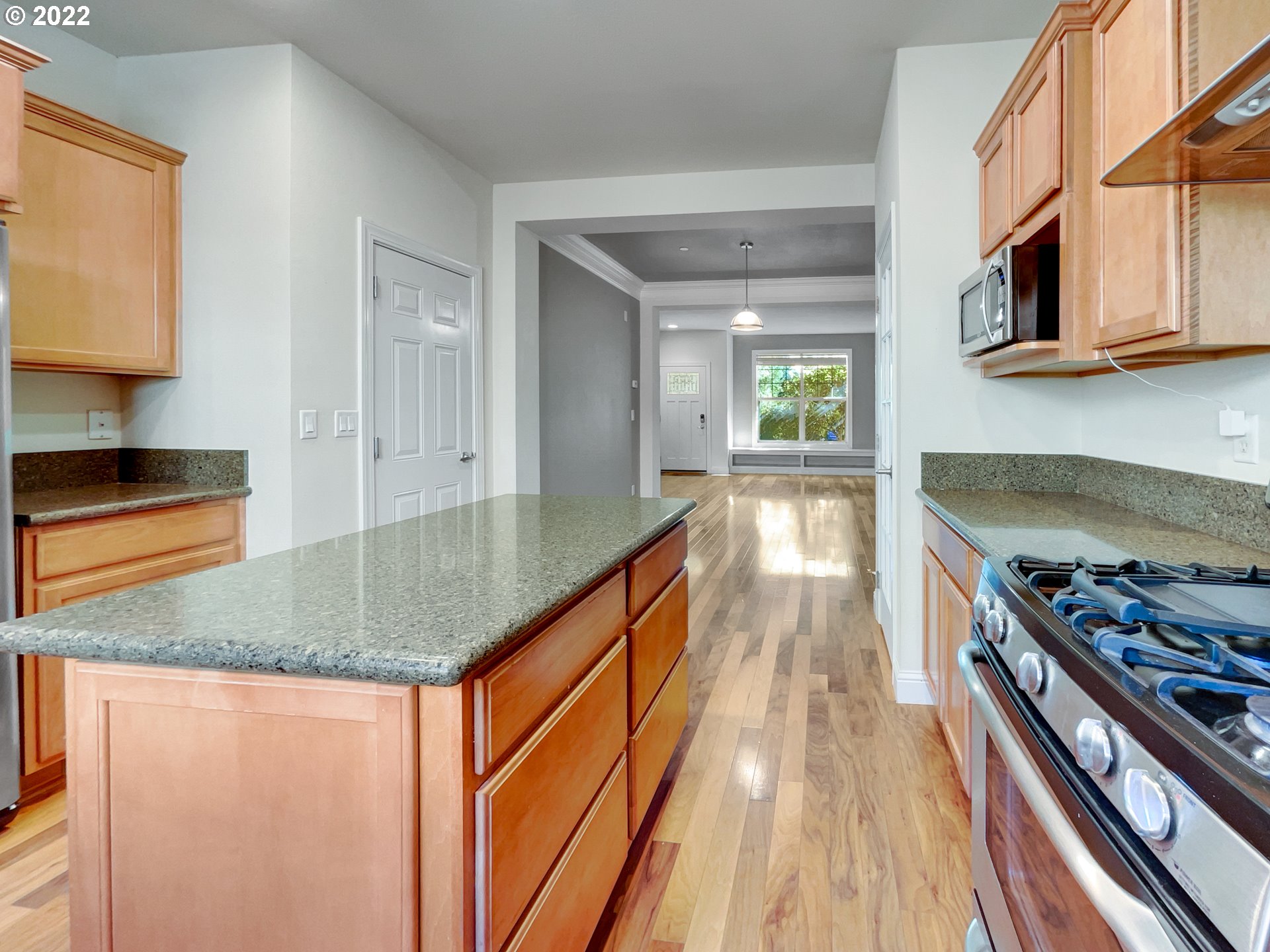 12111 Southeast High Creek Road Happy Valley, OR 97086 - Photo 13 of 14 a kitchen with stainless steel appliances granite countertop a stove and a sink