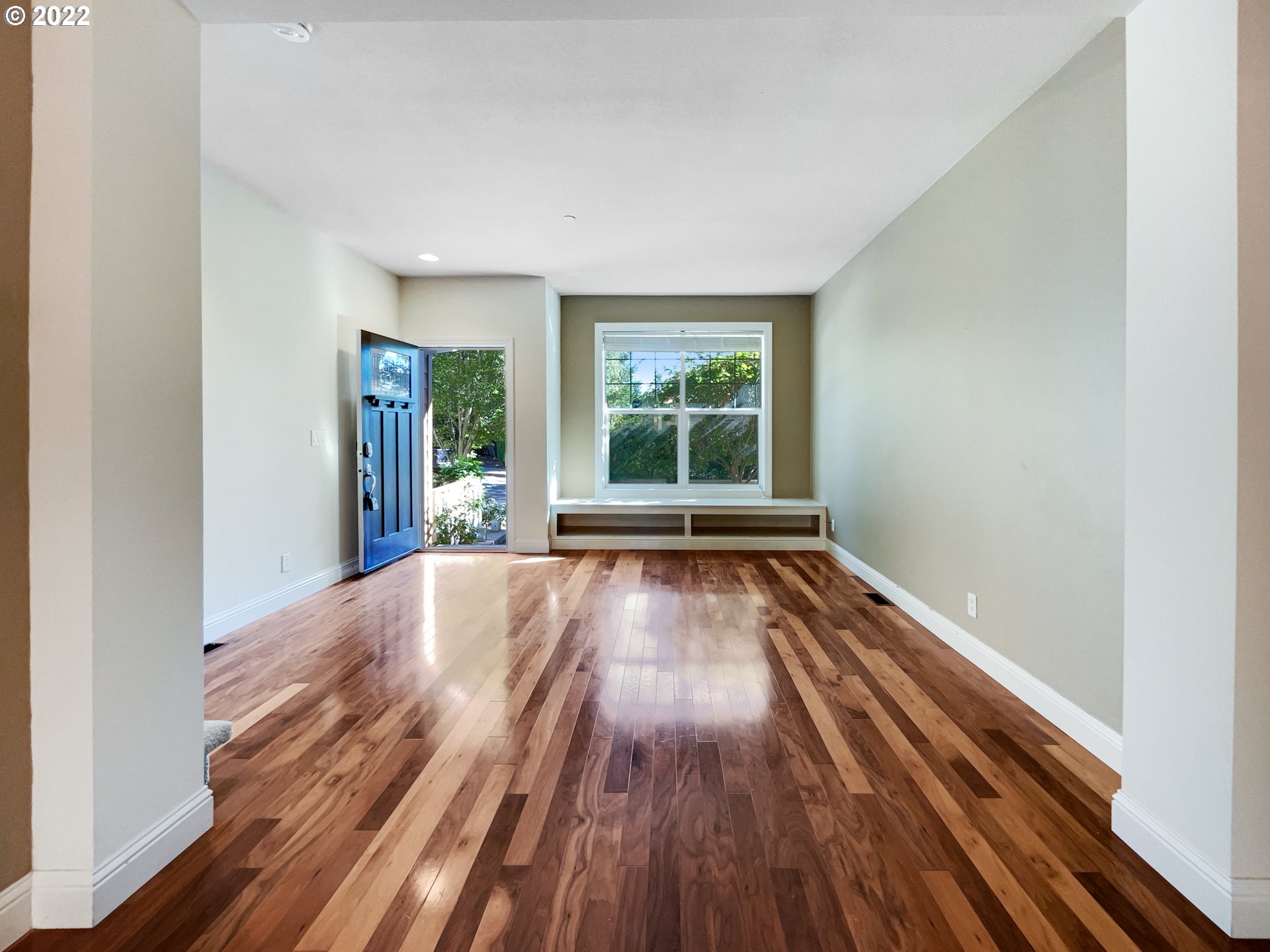 12111 Southeast High Creek Road Happy Valley, OR 97086 - Photo 3 of 14 a view of an empty room with wooden floor and a window