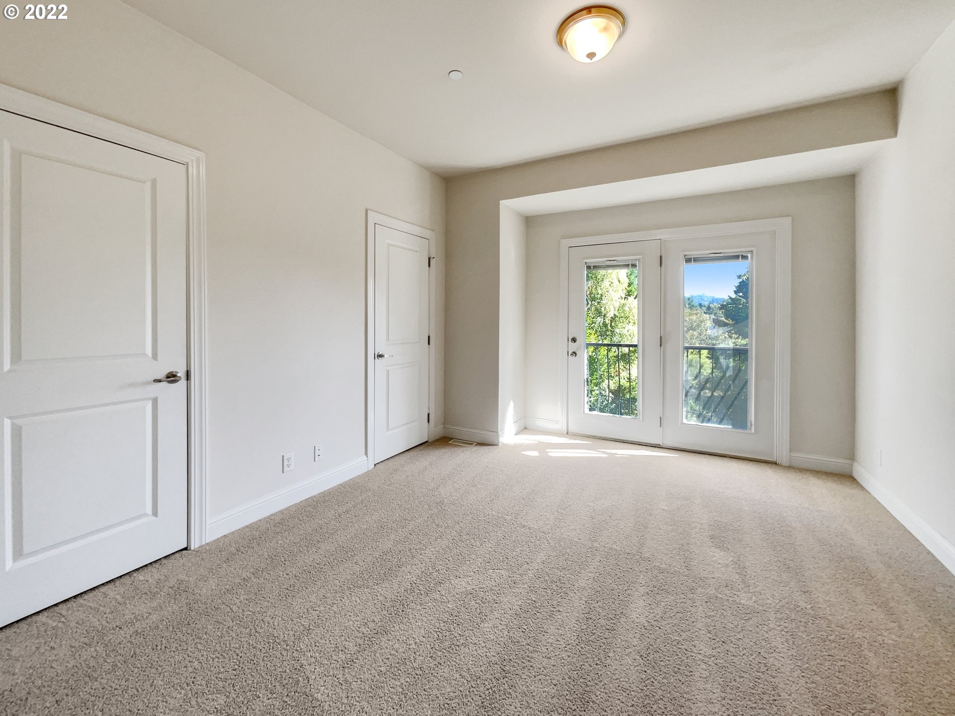 12111 Southeast High Creek Road Happy Valley, OR 97086 - Photo 7 of 14 a view of a livingroom with wooden floor and windows