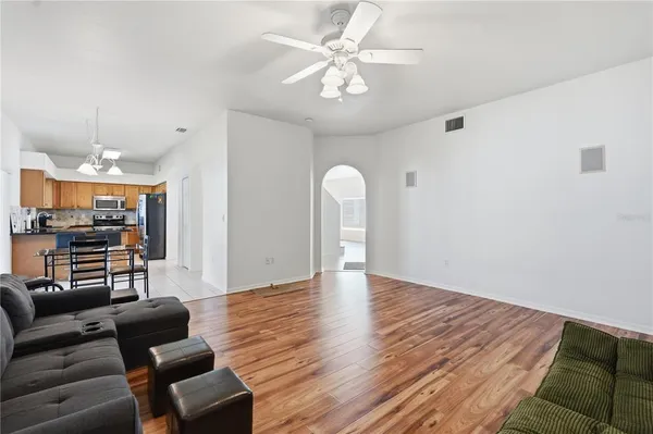 a kitchen with stainless steel appliances granite countertop a stove sink and microwave