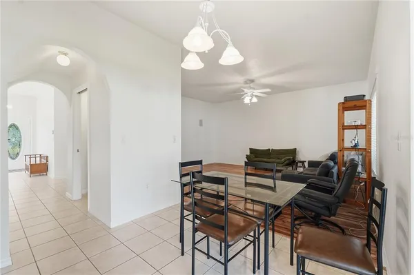 a kitchen with stainless steel appliances granite countertop a refrigerator a sink and a stove