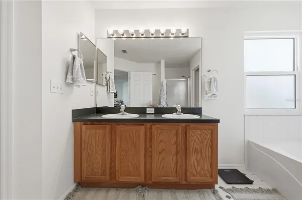 a bedroom with a bed and a view of bedroom