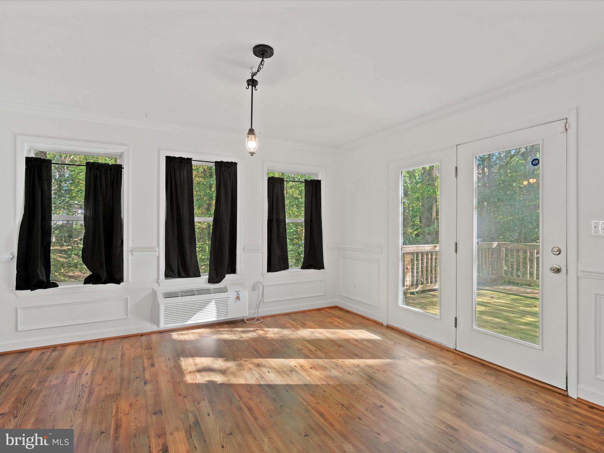 3671 Dory Brooks Road Chesapeake Beach, MD 20732 - Photo 17 of 36 a view of an entryway with wooden floor and door