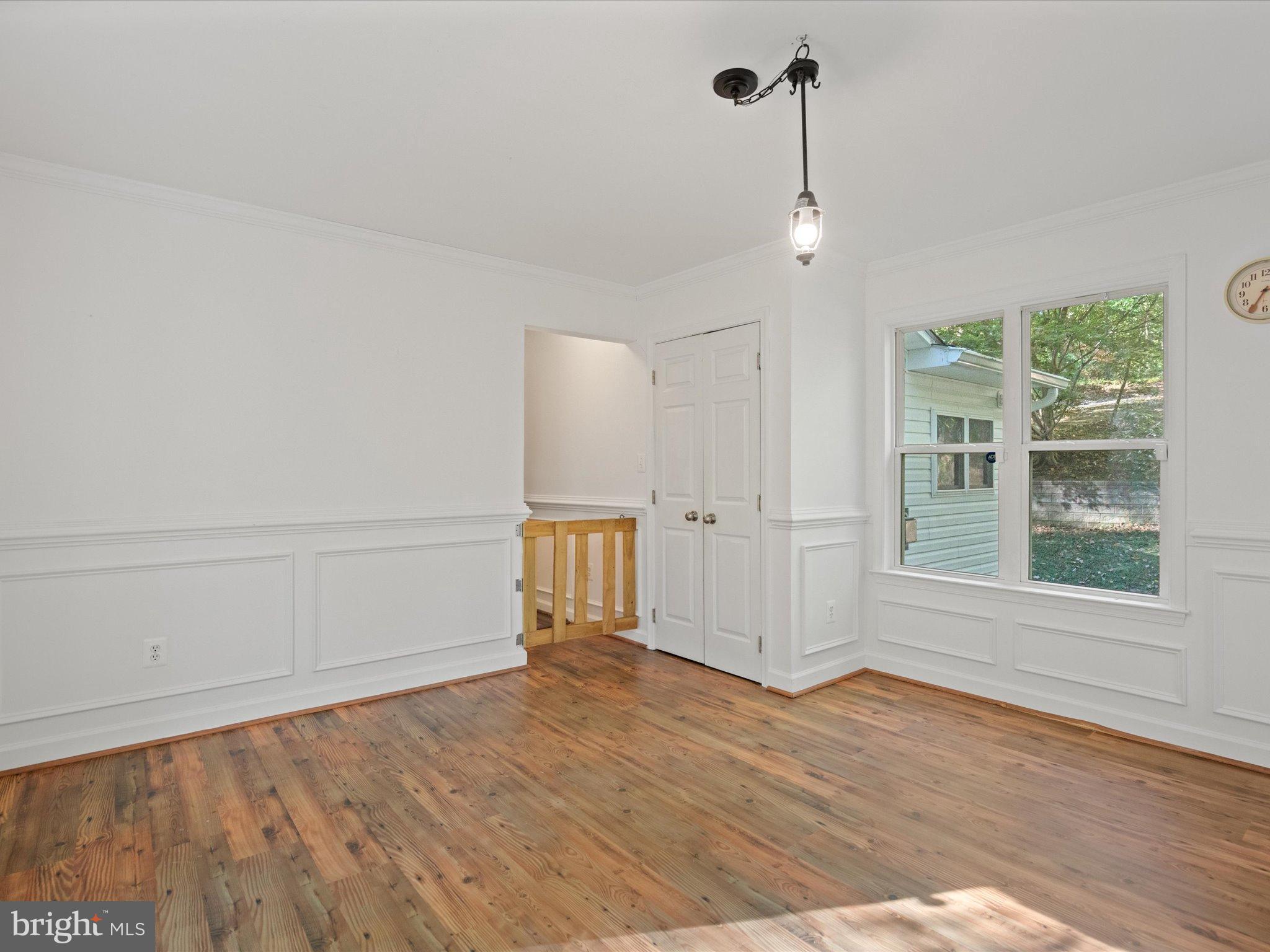 3671 Dory Brooks Road Chesapeake Beach, MD 20732 - Photo 18 of 36 a view of empty room with wooden floor and fan