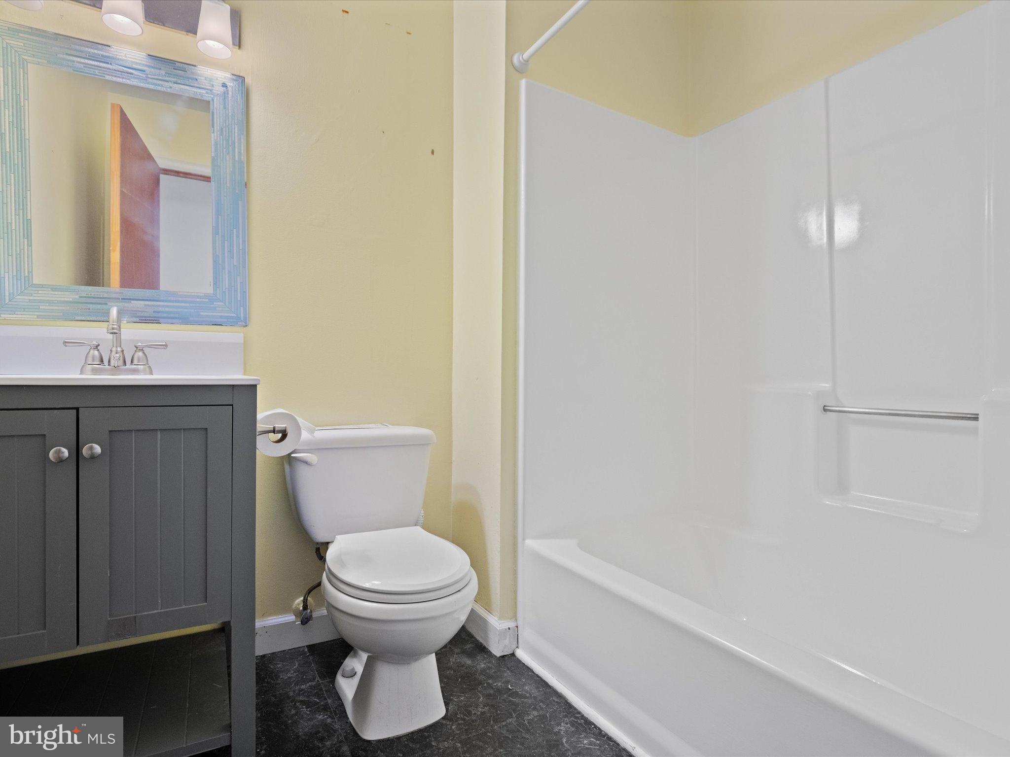 3671 Dory Brooks Road Chesapeake Beach, MD 20732 - Photo 22 of 36 a bathroom with a toilet a sink and bathtub