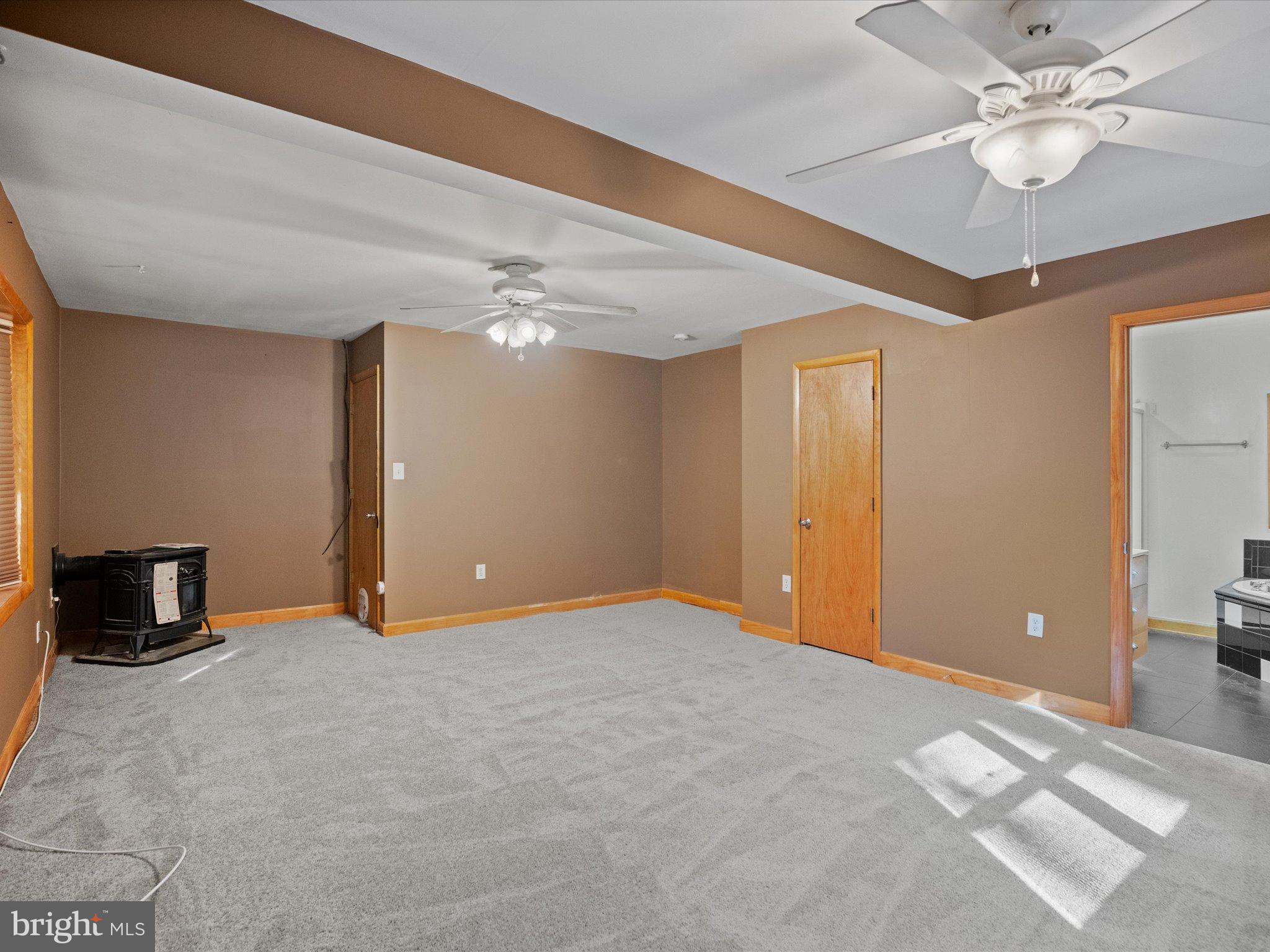 3671 Dory Brooks Road Chesapeake Beach, MD 20732 - Photo 26 of 36 a view of an empty room with a chandelier fan
