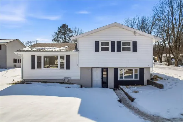 a front view of a house with a yard