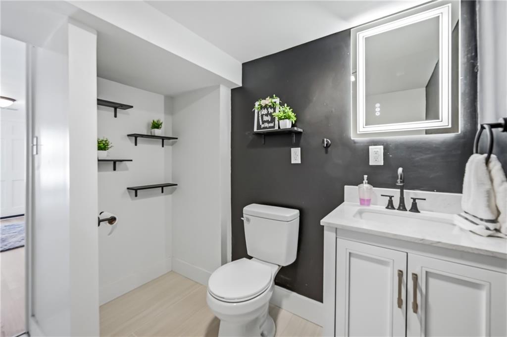 1480 George Street Hermitage, PA 16148 - Photo 14 of 40 a bathroom with a toilet sink and mirror