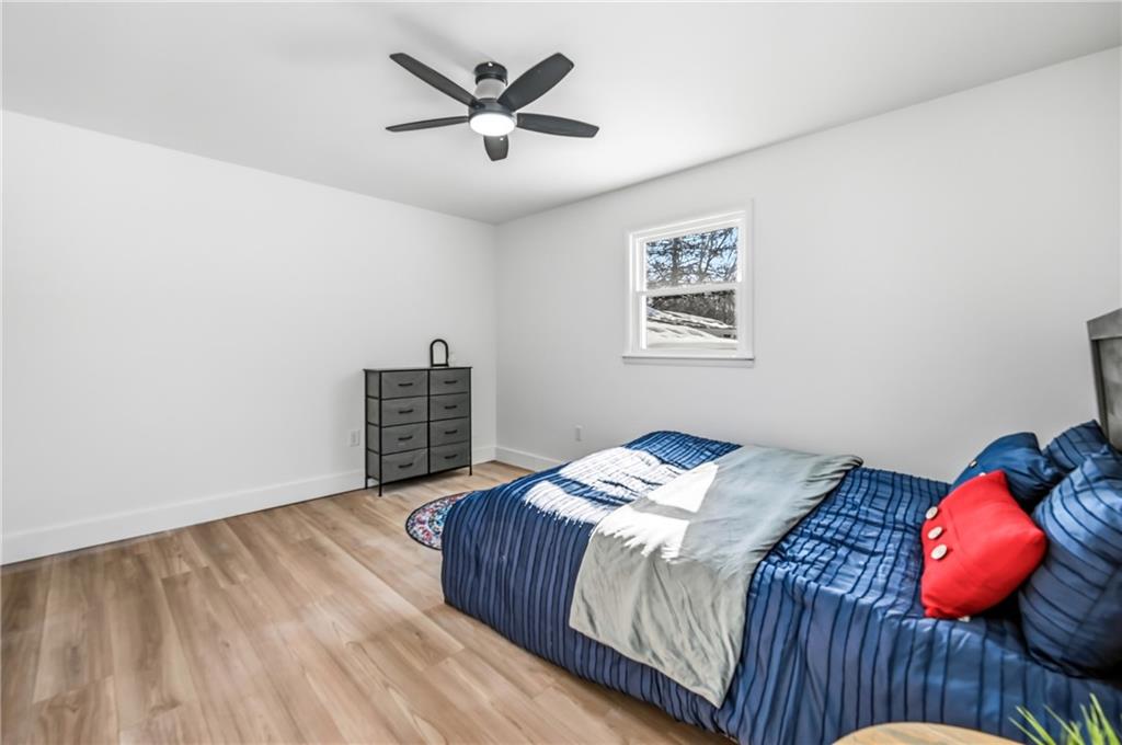 1480 George Street Hermitage, PA 16148 - Photo 22 of 40 a bedroom with a bed and a lamp on dresser
