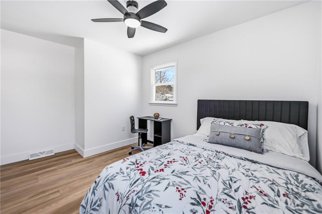 1480 George Street Hermitage, PA 16148 - Photo 24 of 40 a bedroom with a large bed and a window