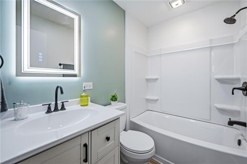 1480 George Street Hermitage, PA 16148 - Photo 27 of 40 a bathroom with a sink a toilet and shower
