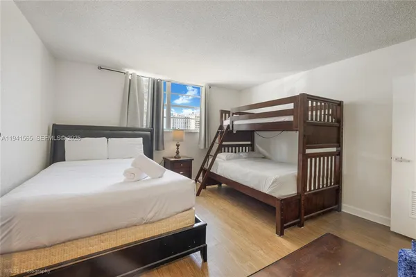 a bedroom with a bed and window