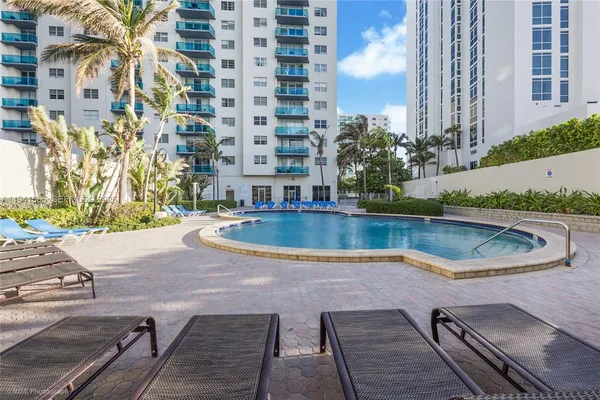 a view of a swimming pool with a patio